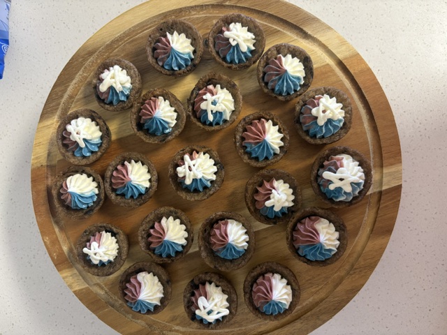 Tray of Little Goose Cake Cups with red, white, and blue buttercream